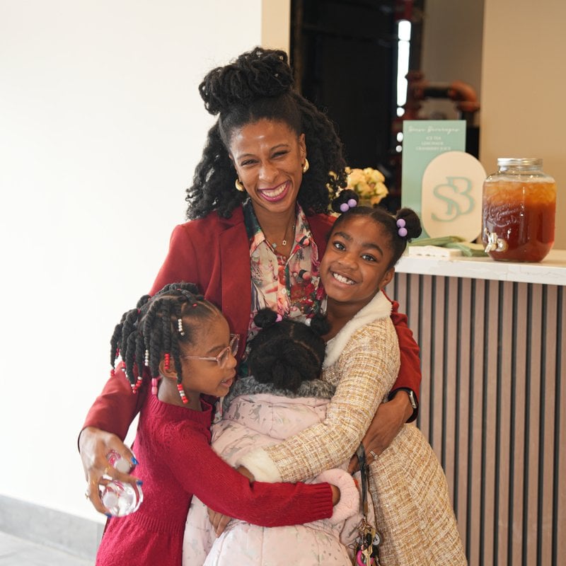 Happy mom with kids at baby shower